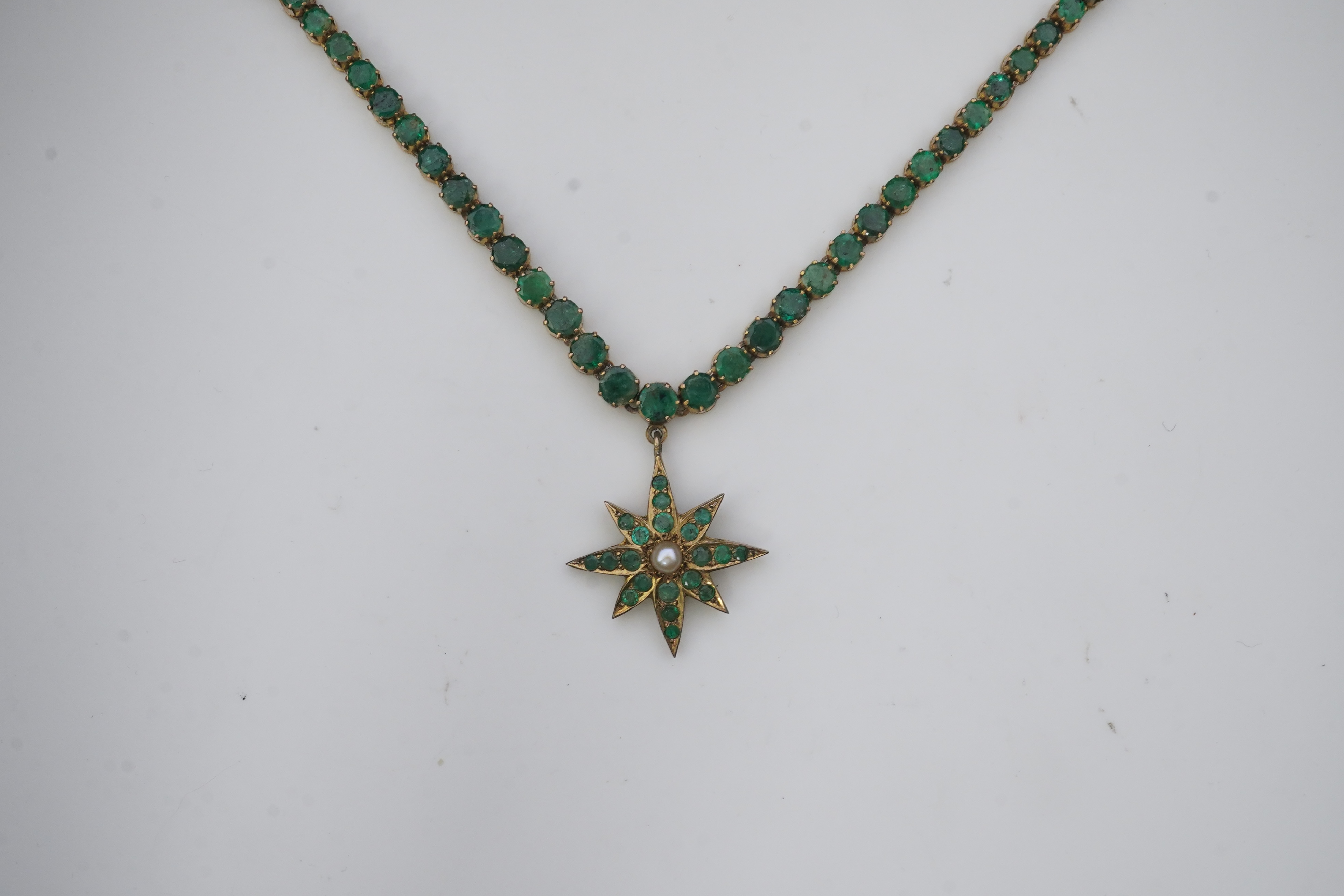 An emerald and pearl necklace